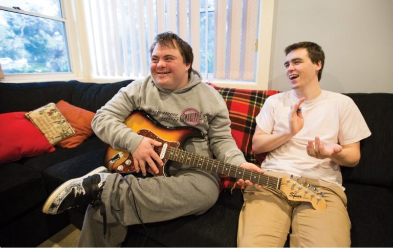 Couple of guys with guitar singing a song