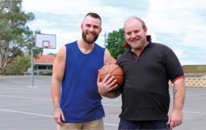 2 guys playing basketball